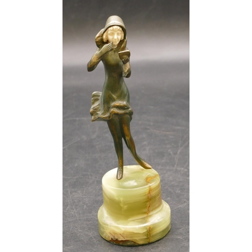 839 - An Art Deco style bronze figure of a lady powdering her face, on green onyx stand, 15.5cm high