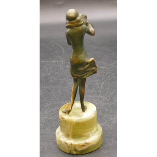 839 - An Art Deco style bronze figure of a lady powdering her face, on green onyx stand, 15.5cm high