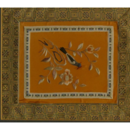 843 - An Oriental silk panel depicting perched bird, in gilt frame, 27.5cm x 23.5cm and a circular embroid... 