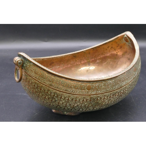 980 - An Eastern copper oval boat shaped 2-handled bowl with allover raised decoration 23.5cm wide