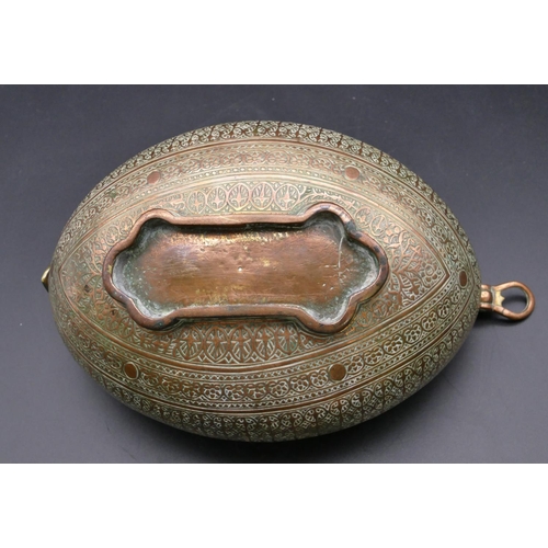 980 - An Eastern copper oval boat shaped 2-handled bowl with allover raised decoration 23.5cm wide