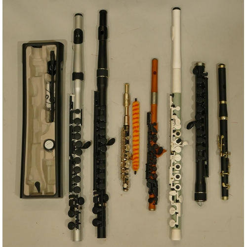 991 - A Yamaha 32 piccolo and various wood, aluminium and plastic flutes including a Nuvo Student Flute 2,... 