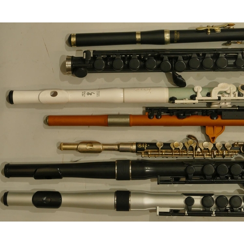 991 - A Yamaha 32 piccolo and various wood, aluminium and plastic flutes including a Nuvo Student Flute 2,... 