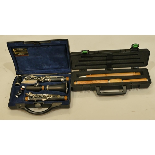 995 - A Buffet Crampon & Cie A Paris  B12 clarinet, cased and a wood flute 66cm long in McNeela case (1 po... 