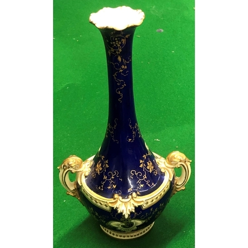 191 - A Coalport round bulbous thin necked trumpet shaped 2 handled vase on blue and cream ground with han... 