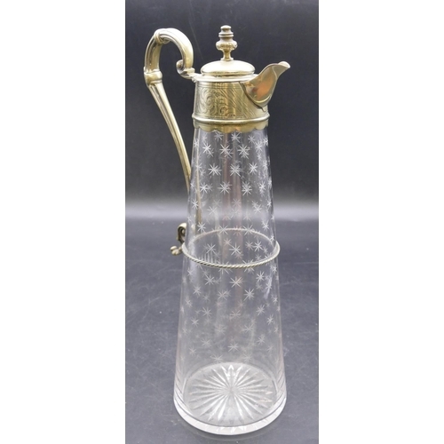 441 - An engraved glass round claret jug with silver plated neck, hinged lid and scroll handle with allove... 