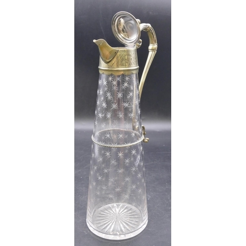 441 - An engraved glass round claret jug with silver plated neck, hinged lid and scroll handle with allove... 