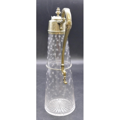 441 - An engraved glass round claret jug with silver plated neck, hinged lid and scroll handle with allove... 