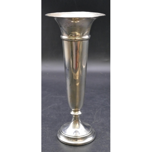 472 - A George V silver round trumpet shaped spill vase on weighted splayed base, Chester 1913, 21cm high ... 