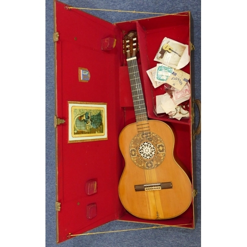 1092 - A classical acoustic Spanish guitar with parquetry decoration and pierced ivory centre in fitted cas... 