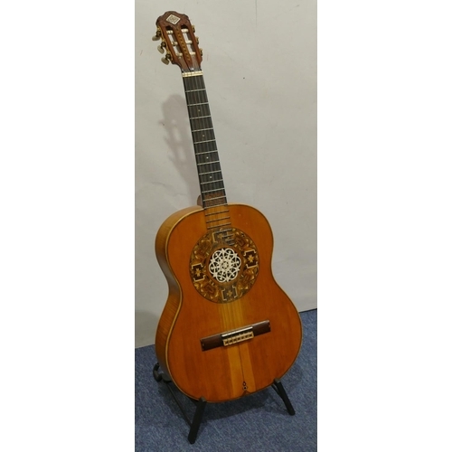 1092 - A classical acoustic Spanish guitar with parquetry decoration and pierced ivory centre in fitted cas... 