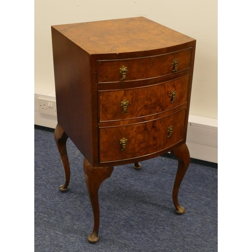 1156 - A burr walnut bow fronted bedside cupboard with 1 drawer and single panelled door in the form of 2 d... 