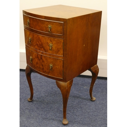 1156 - A burr walnut bow fronted bedside cupboard with 1 drawer and single panelled door in the form of 2 d... 