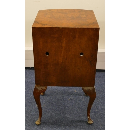 1156 - A burr walnut bow fronted bedside cupboard with 1 drawer and single panelled door in the form of 2 d... 