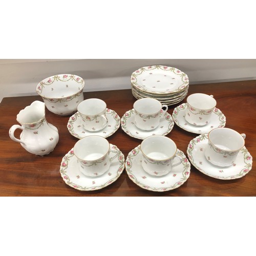 6173 - A part white china tea service, with floral pattern, 6 side plates, 6 saucers, 6 cups, 1 sugar bowl,... 