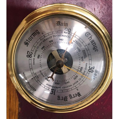 6182 - An English pewter hammered tray, a plated round tray and a brass coloured Weathermaster barometer