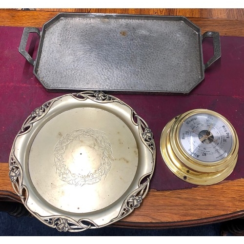 6182 - An English pewter hammered tray, a plated round tray and a brass coloured Weathermaster barometer