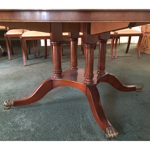 6188 - A large good quality reproduction mahogany circular 12 seat dining table on pedestal base with 4 spl... 