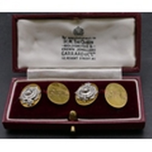 717 - A pair of 9ct gold Royal Marine oval cufflinks with raised crests, 13.6 grams (engraved initials) (b... 