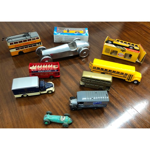 7104 - Various toy buses, tram, truck and racing car.