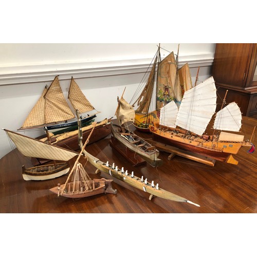 7099 - 8 various model boats including a Dutch clog boat with lamp bulb fitting.