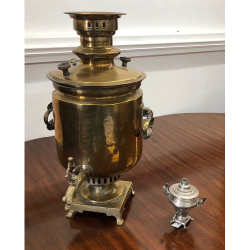 7098 - A large brass samovar 52.5cm high, stamped to top and a miniature metallic samovar, 12cm high.