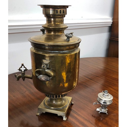 7098 - A large brass samovar 52.5cm high, stamped to top and a miniature metallic samovar, 12cm high.