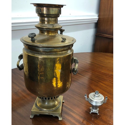 7098 - A large brass samovar 52.5cm high, stamped to top and a miniature metallic samovar, 12cm high.