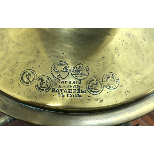 7098 - A large brass samovar 52.5cm high, stamped to top and a miniature metallic samovar, 12cm high.