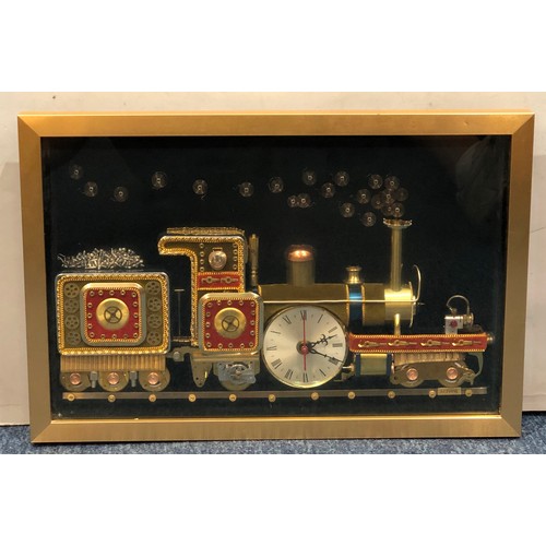 7095 - A framed clock in the form of a train made up of various clock parts, signed to reverse and labelled... 