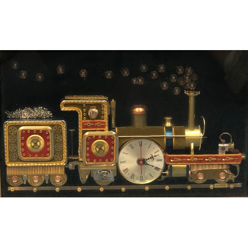 7095 - A framed clock in the form of a train made up of various clock parts, signed to reverse and labelled... 