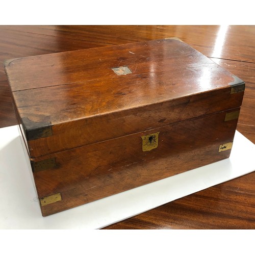 7091 - A wooden writing box with brass edge detail, hinged lid enclosing black leather writing slope, stora... 