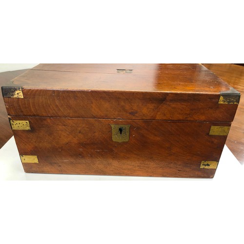 7091 - A wooden writing box with brass edge detail, hinged lid enclosing black leather writing slope, stora... 