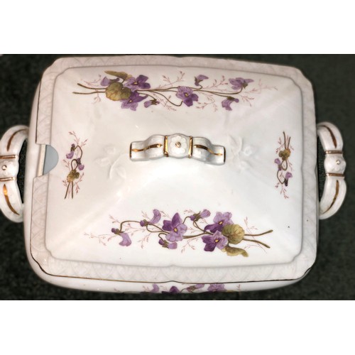 7088 - A large china dinner service on white ground with purple sweet pea decoration and gilt detail. 30 di... 