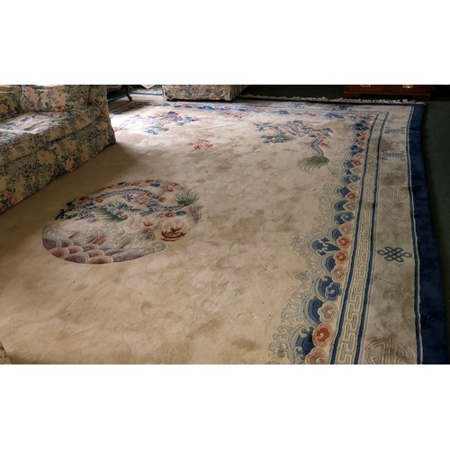 7084 - A large Oriental silk carpet on cream ground with blue, grey and pale green centre medallion and edg... 