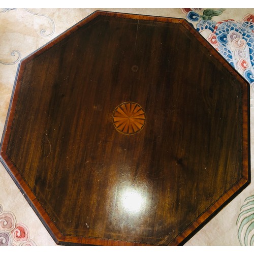 7079 - A small occasional table with hexagonal top and marquetry to centre, shelf below, 70cm high, top 54.... 