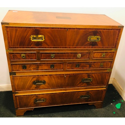 7074 - A reproduction campaign secretaire chest of drawers with fall front enclosing 4 small drawers and st... 