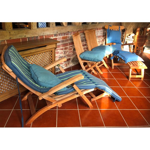 7069 - 2 teak steamer garden chairs, 2 teak folding chairs, a small teak folding oval table and various gar... 