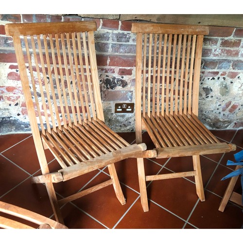 7069 - 2 teak steamer garden chairs, 2 teak folding chairs, a small teak folding oval table and various gar... 