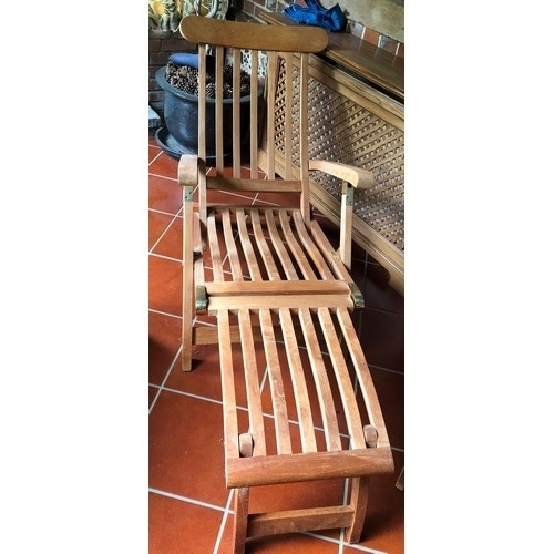 7069 - 2 teak steamer garden chairs, 2 teak folding chairs, a small teak folding oval table and various gar... 