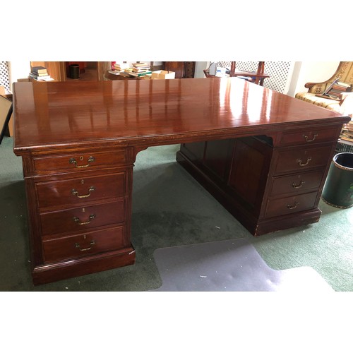 7065 - A large reproduction good quality partners desk, 8 drawers to 1 side and 2 cupboards to the other si... 