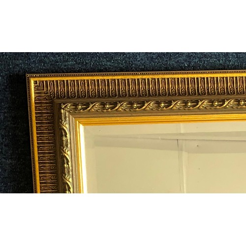 7012 - A rectangular gilt wall mirror, 81.5cm high, 58cm wide. (Item not held by P.F Windibank, please call... 