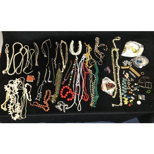 7107 - A large quantity of costume jewellery, necklaces, beads, buttons etc.