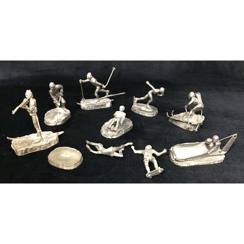 7102 - 1980 XIII Olympic Winter Games Lake Placid pewter figures of athletes including ice skater, Nordic s... 