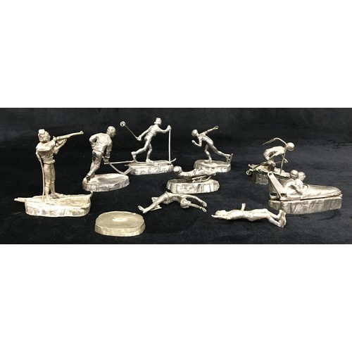 7102 - 1980 XIII Olympic Winter Games Lake Placid pewter figures of athletes including ice skater, Nordic s... 