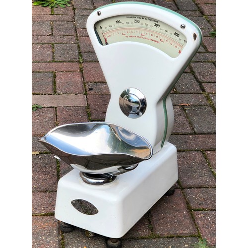 7129 - A set of white enamelled Stevens shop scales, 47.5cm high