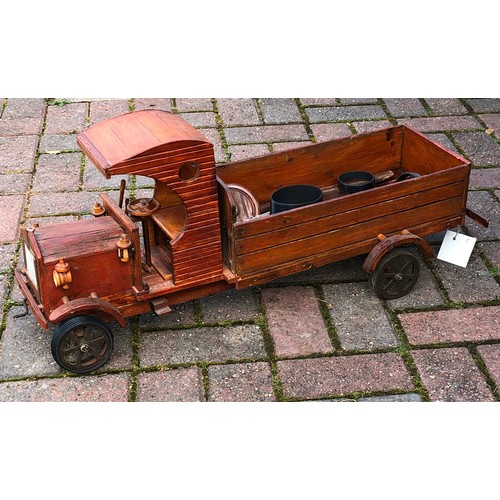 7131 - A wooden model of a vintage truck 32cm high, 75cm long