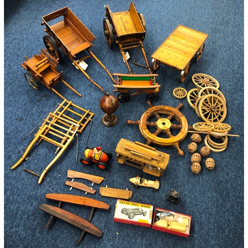 7140 - A quantity of handmade wooden carts, a musical wooden circus railway carriage (working), various spa... 