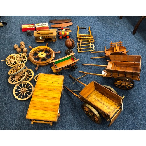 7140 - A quantity of handmade wooden carts, a musical wooden circus railway carriage (working), various spa... 