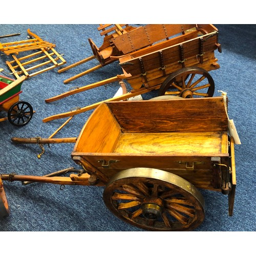 7140 - A quantity of handmade wooden carts, a musical wooden circus railway carriage (working), various spa... 